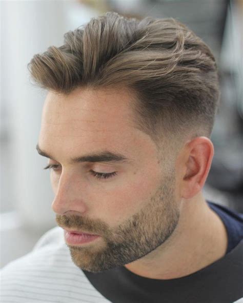 Haircuts for men medium fade - Jun 15, 2019 · Short Faux Hawk Taper. The fohawk taper is one of the most popular haircut styles for guys. This taper is buzzed around the ears and drops down to the neck for a clean cut look. The short faux hawk on top is spiked in the front with the rest of the hair styled forward, making it dapper and dashing. 